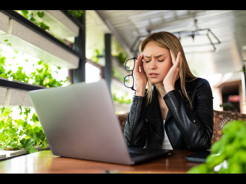 freelance-woman-headache-tired-stess-deadline-with-digital-laptop-working-workplace-coffee-shop2.jpg